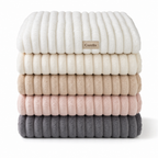 All five Cozella throw colours folded and stacked