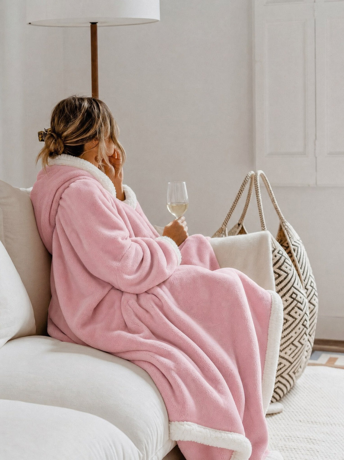 Cozella Longline Blanket Robe in Blush Pink worn on a cream sofa