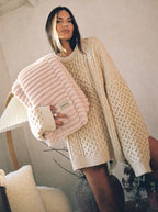 Cozella Ribbed Plush Throw in Blush Pink folded and held